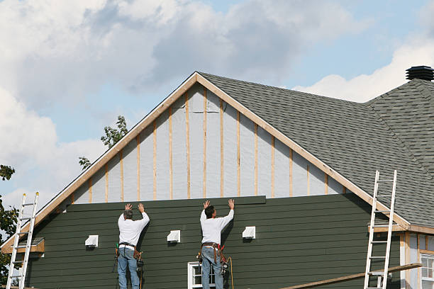 Professional Emergency Siding Repair technician working in Tuscarawas, OH